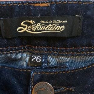 Dark wash skinny Serfontaine jeans.